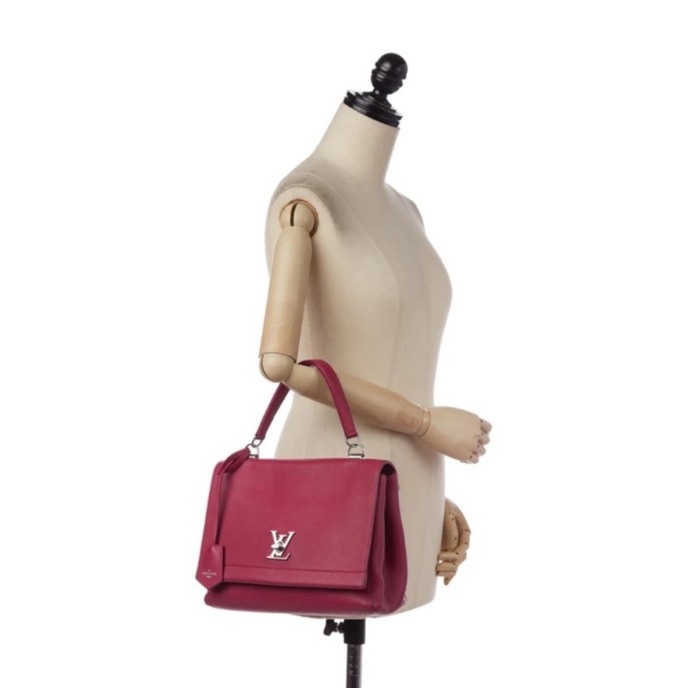 Louis Vuitton LockMe II in Pink Dahlia with Silver Hardware.